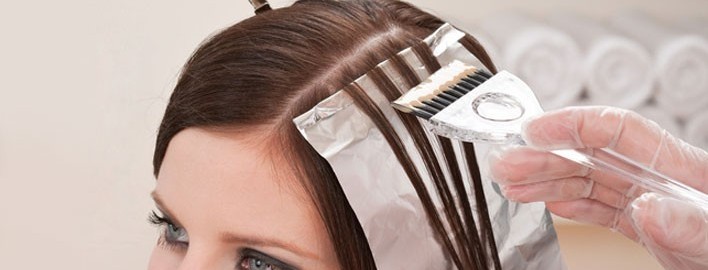 girl getting hair coloured